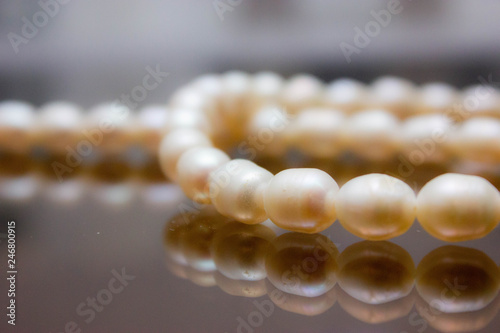  female pearl beads in reflection