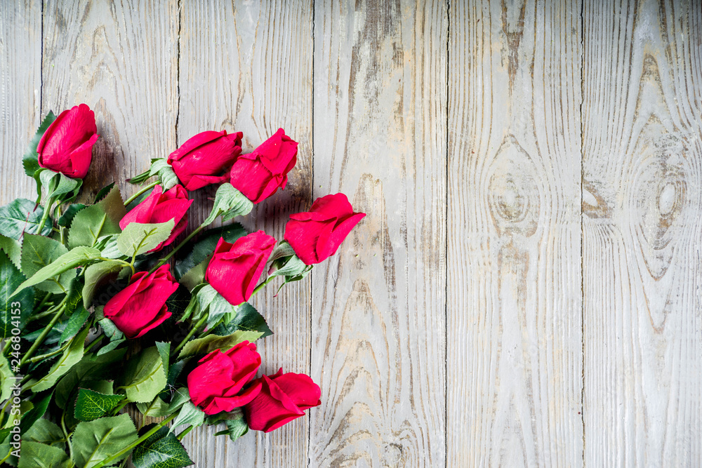 Valentine day concept, Red roses with two champagne glasses, copy space top view Valentine day concept, Red roses with two champagne glasses, copy space top view