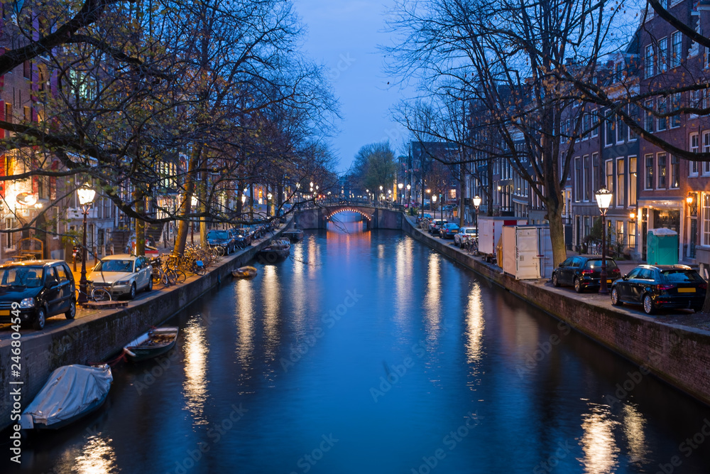 Fototapeta premium City scenic from Amsterdam in the Netherlands at sunset