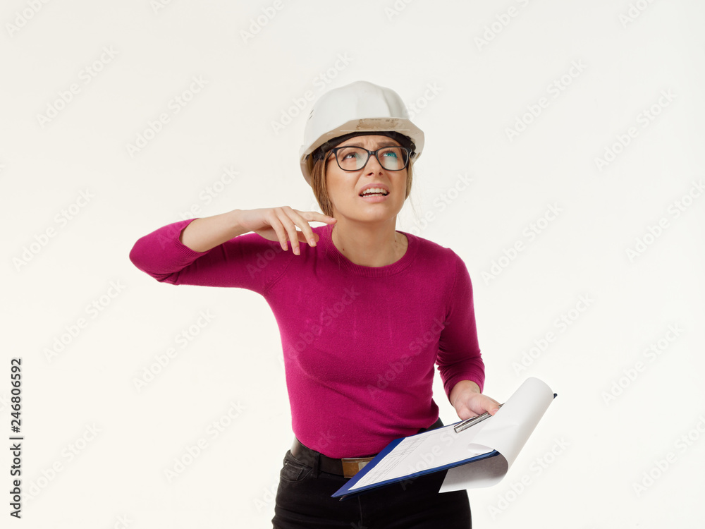 emotional girl foreman in a helmet on a white background. emotional girl foreman in a helmet on a white background.
