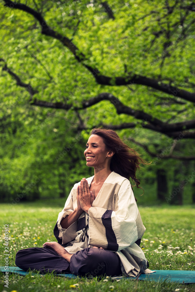 attractive woman practicing yoga in nature attractive woman practicing yoga in nature