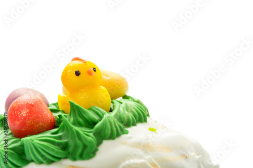 Top part of Easter cake with cream and funny chick. © laticka