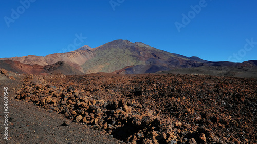 Volcanic landscape with lava Aa at Montaña Samara hike, one of the most unusual alien-like environment found at Teide National Park, with views towards Pico del Teide, Pico Viejo and Las Cuevas Negras