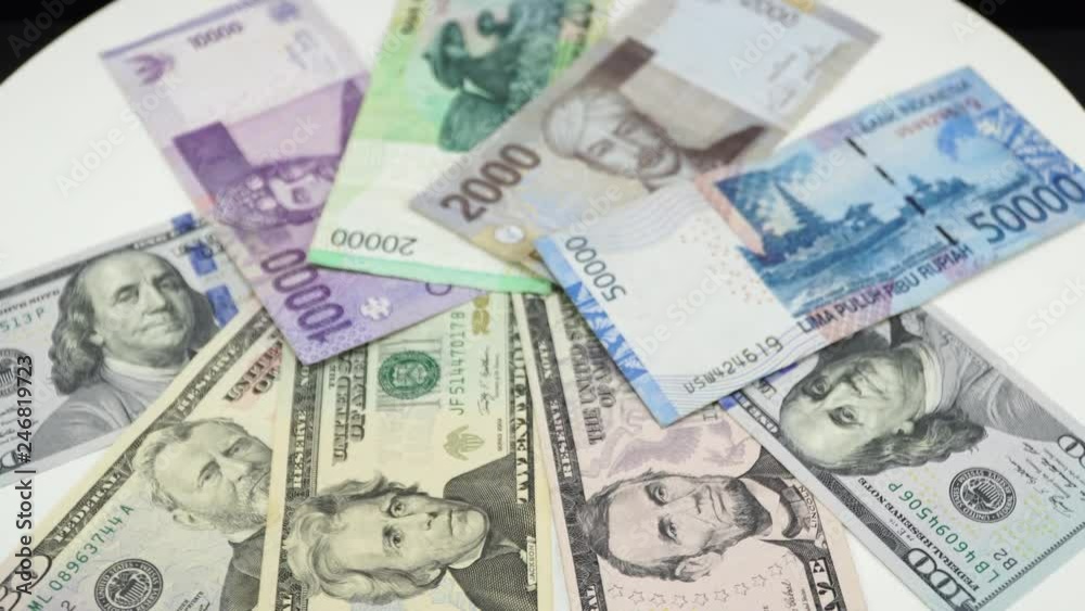Indonesia money and US dollar on white background. 4K Indonesia money and US dollar on white background. 4K