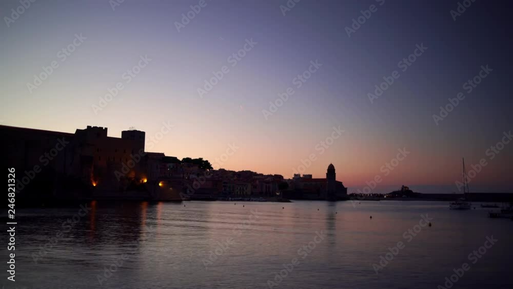 Beautiful time-lapse video with the small bay with old church of Our Lady of the Angels in the Collioure at late evening, France. Beautiful time-lapse video with the small bay with old church of Our Lady of the Angels in the Collioure at late evening, France.