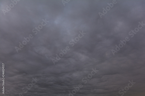 The sky covered with gray, heavy clouds.