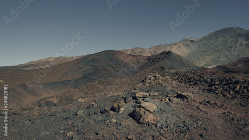 Futuristic color effect of the volcanic landscape of Pico del Teide and Pico Viejo, in Teide National Park, concept for alien and life origin, environmental impact of the elements or life extinction