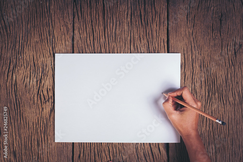 Top view Hand with blank white paper