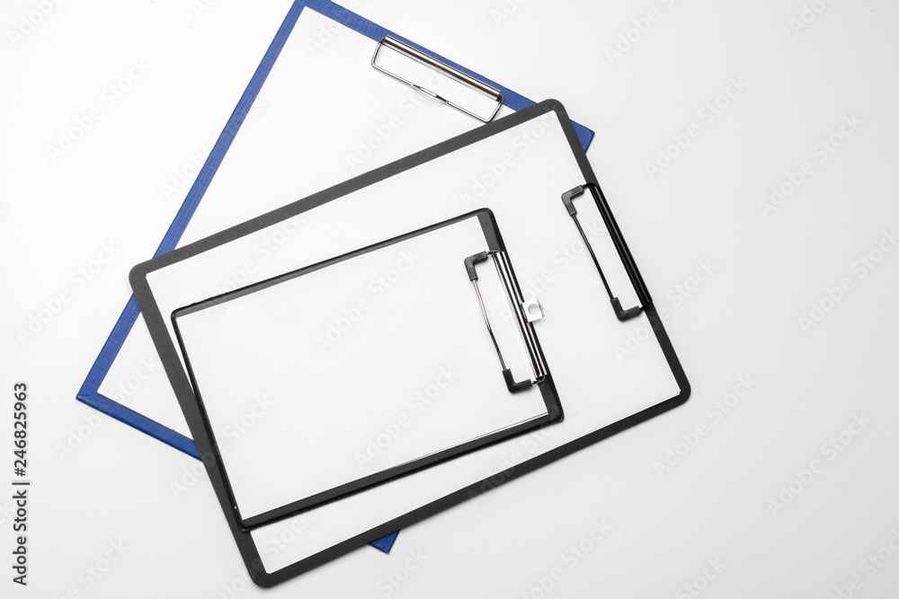 Black clipboard with blank white sheet attached on white background Black clipboard with blank white sheet attached on white background