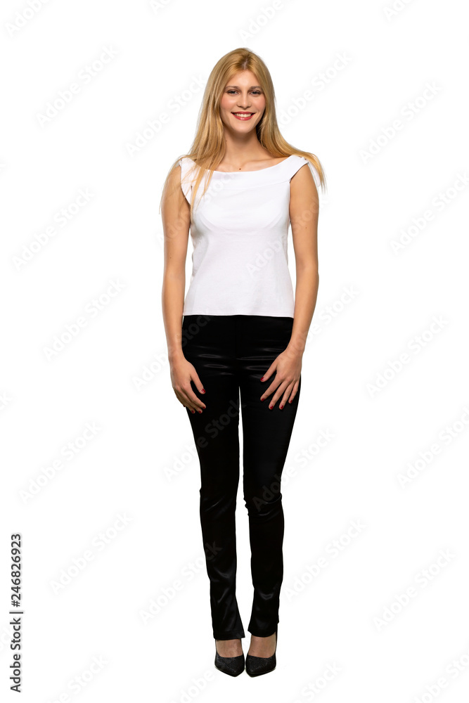 Young blonde woman posing and laughing looking to the front over isolated white background Young blonde woman posing and laughing looking to the front over isolated white background
