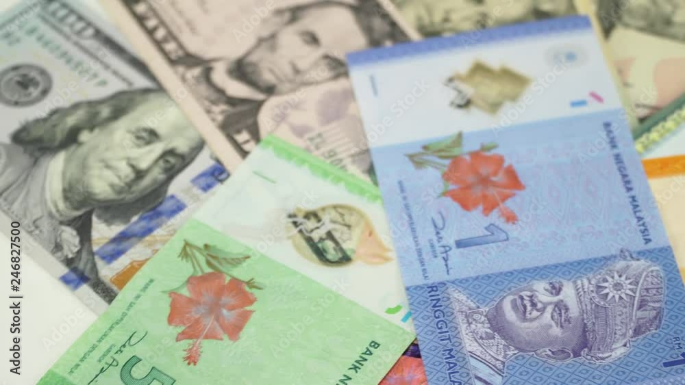 US dollar and Malaysia money on the table rotating. 4K
