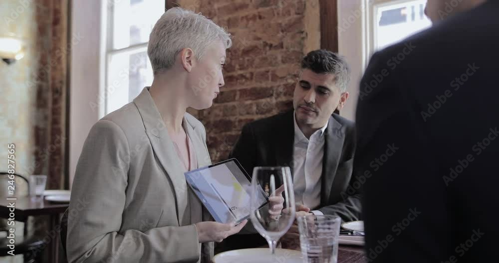 Business executives having a working lunch in a restaurant