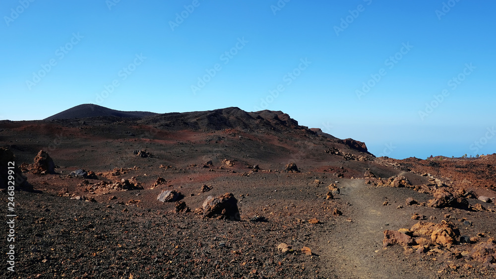 Path through the lunar landscape of Montaña Samara in Teide National Park, one of the most alien-like, volcanic land in Tenerife with views towards Pico del Teide, Pico Viejo and Las Cuevas Negras Path through the lunar landscape of Montaña Samara in Teide National Park, one of the most alien-like, volcanic land in Tenerife with views towards Pico del Teide, Pico Viejo and Las Cuevas Negras