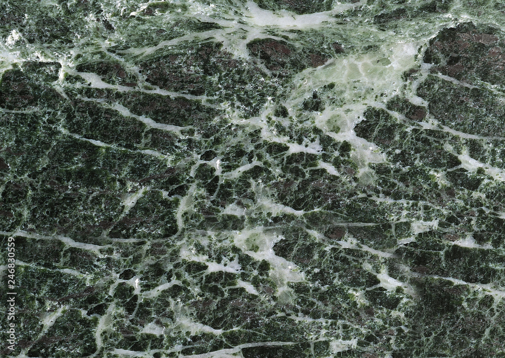 Naklejka premium Textured grey marble stone with white streaks