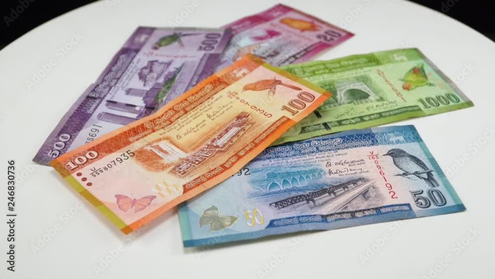 Sri Lankan money. White background on the desk. 4K Sri Lankan money. White background on the desk. 4K