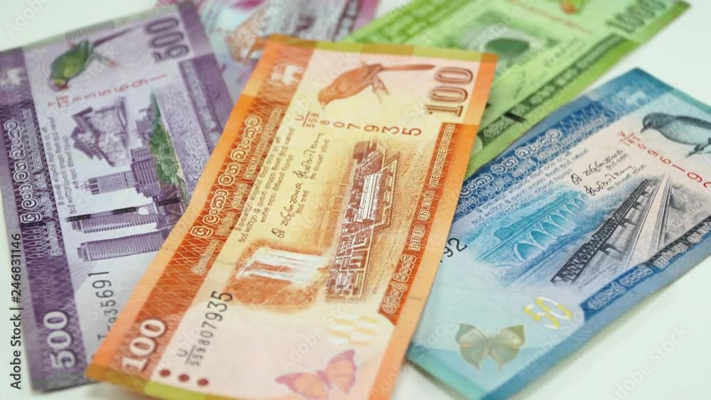 Sri Lankan money. White background on the desk. 4K Sri Lankan money. White background on the desk. 4K