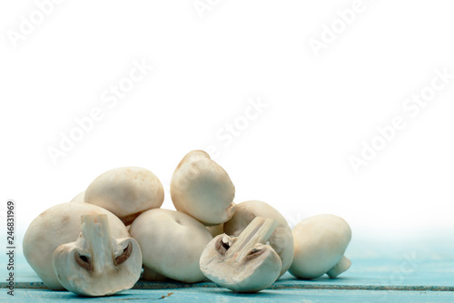 Fresh champignon mushrooms on a white background
