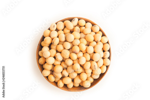 Soybeans on wooden bowl on white background