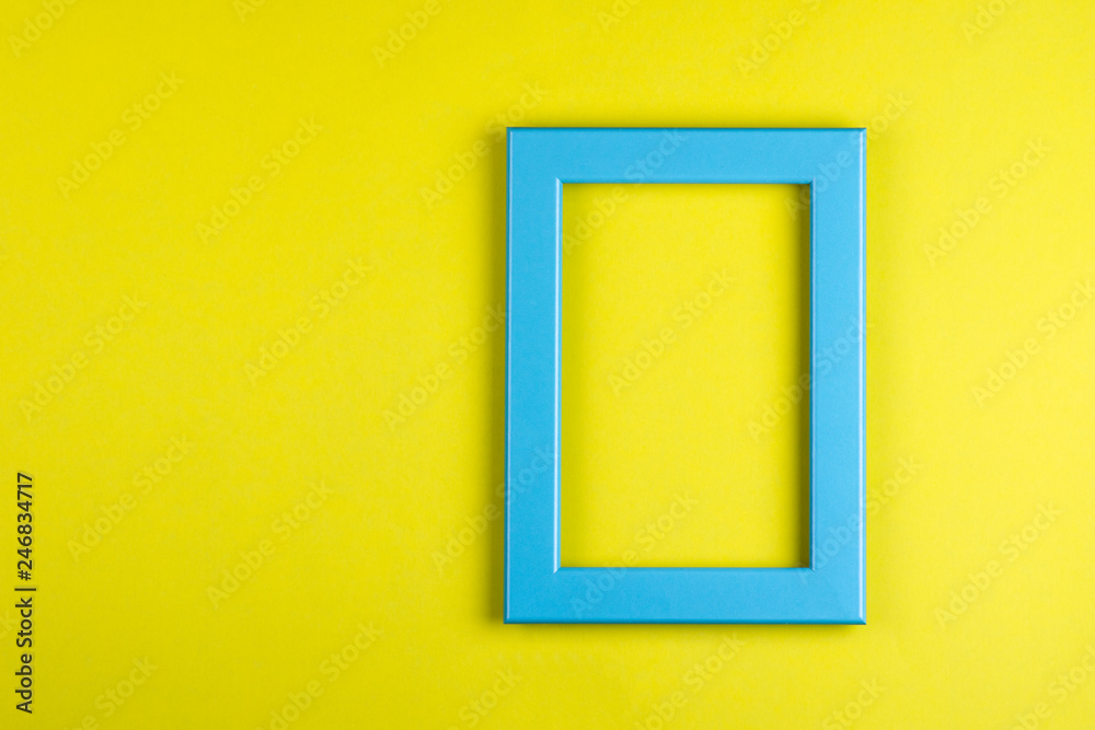 turquoise photo frame on yellow background