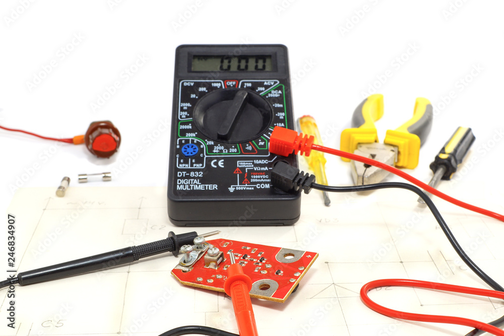Tool kit for electrician, also multimeter with connectors on white background. Tool kit for electrician, also multimeter with connectors on white background.