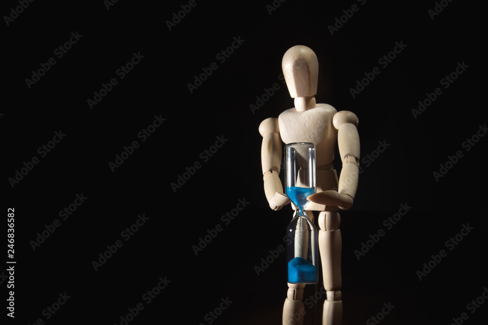 the wooden man with the hourglass the wooden man with the hourglass