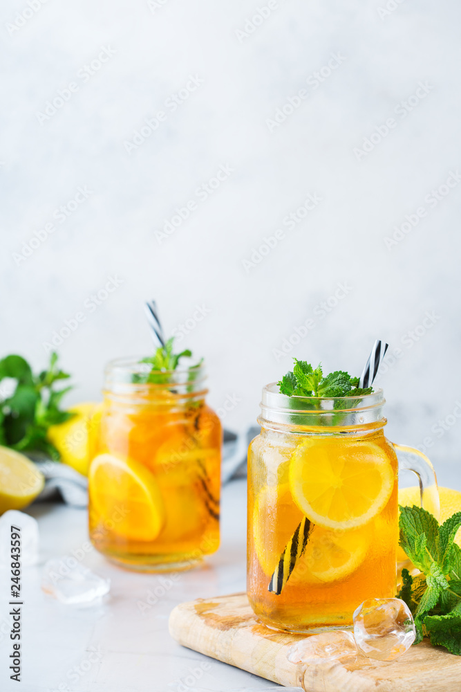 Fototapeta premium Lemon mint iced tea cocktail refreshing drink for summer days