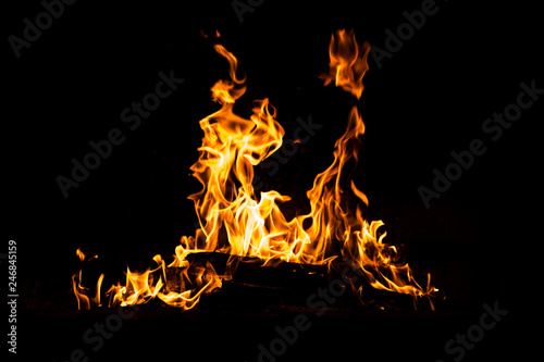 Fire flames burning isolated on black background. High resolution wood fire flames collection smoke texture background concept image.