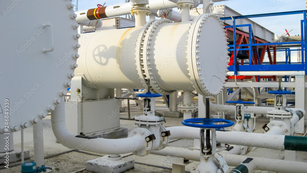 Heat exchangers in a refinery. Heated gasoline air cooler. The e Heat exchangers in a refinery. Heated gasoline air cooler. The e