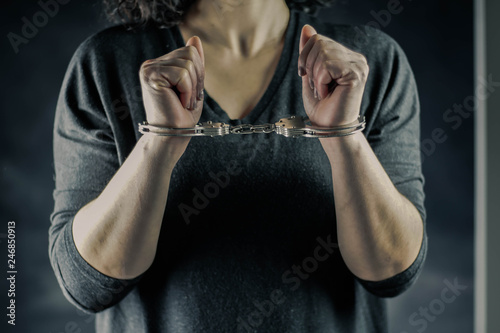 Slika na platnu women handcuffed in criminal concept