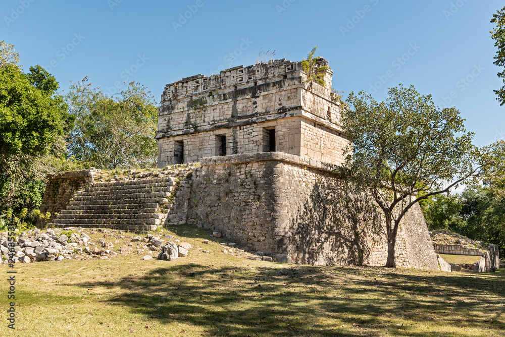 Red colored house in Chichen Itza. Monumental temple found in Yucatán, Mexico