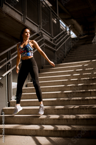 Young fitness woman doing exercises outdoor © BGStock72