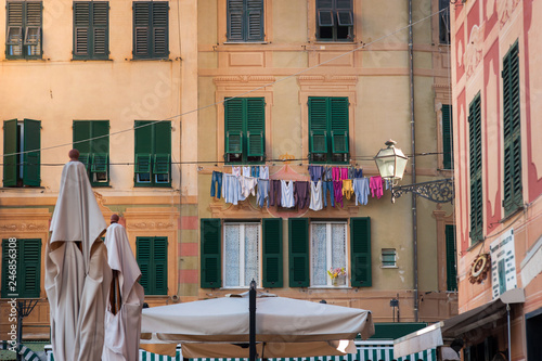 colorful old facade with dry clothes in small village Camogli
