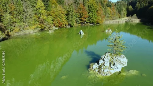 AERIAL - Lake Berglsteiner, a beautiful lake with green color in the TIroler Alps with the DJI Phantom 4. photo