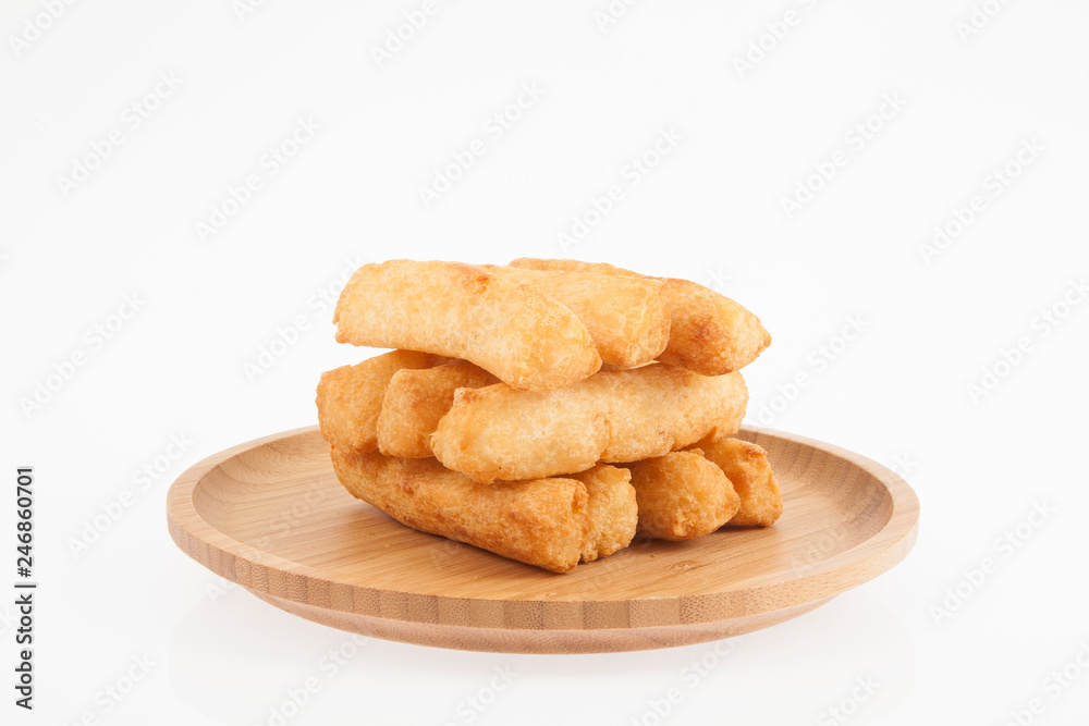 tasty fried yucca sticks on white background tasty fried yucca sticks on white background