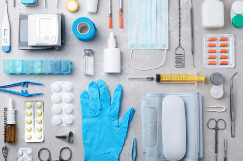 Flat lay composition with medical objects on grey background