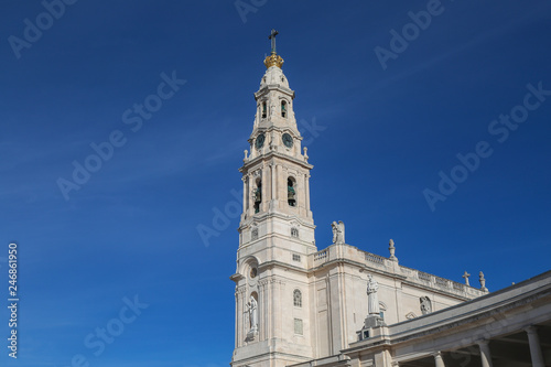 Detail of the belltower of the basilica of fatima with a clear sky in summer