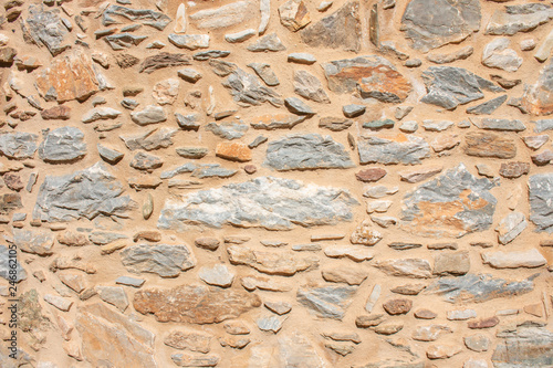 Texture of a stone wall. Old castle stone wall texture background. Briks stone and wall texture. Greek old wall of castle. photo