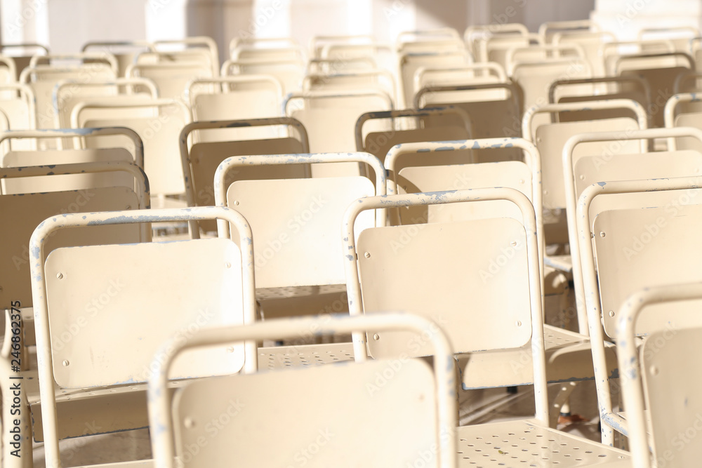 Fototapeta premium Rows of white chairs outdoor