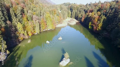 AERIAL - Lake Berglsteiner, a beautiful lake with green color in the TIroler Alps with the DJI Phantom 4. photo