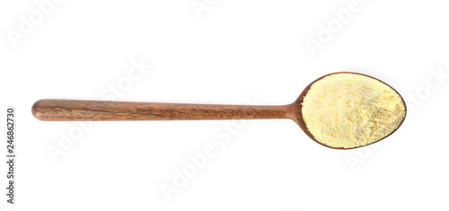 Spoon of corn flour isolated on white, top view