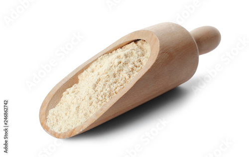Scoop of sesame flour isolated on white