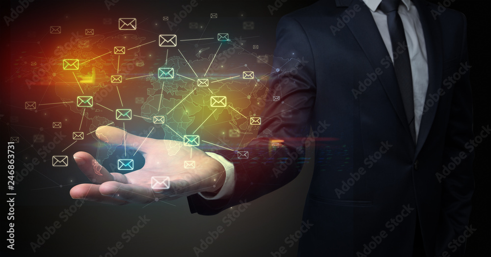 Elegant businessman holding communication concept on his hand Elegant businessman holding communication concept on his hand