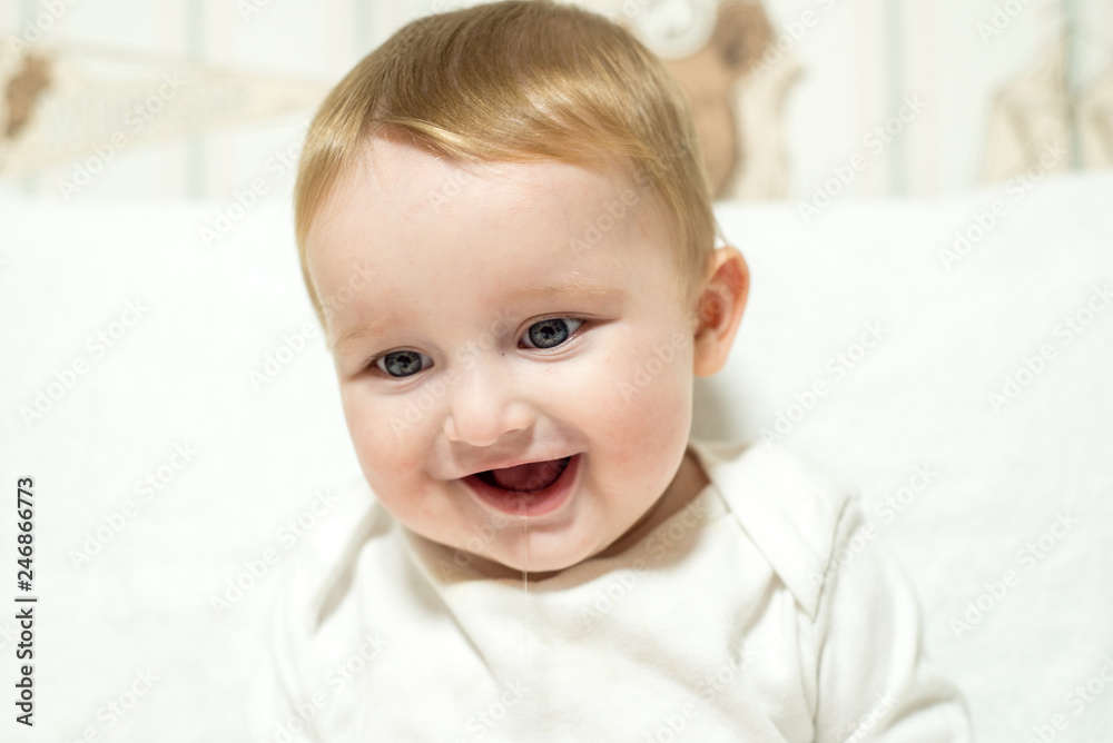 First tooth. After swimming in a white towel and a white T-shirt First tooth. After swimming in a white towel and a white T-shirt