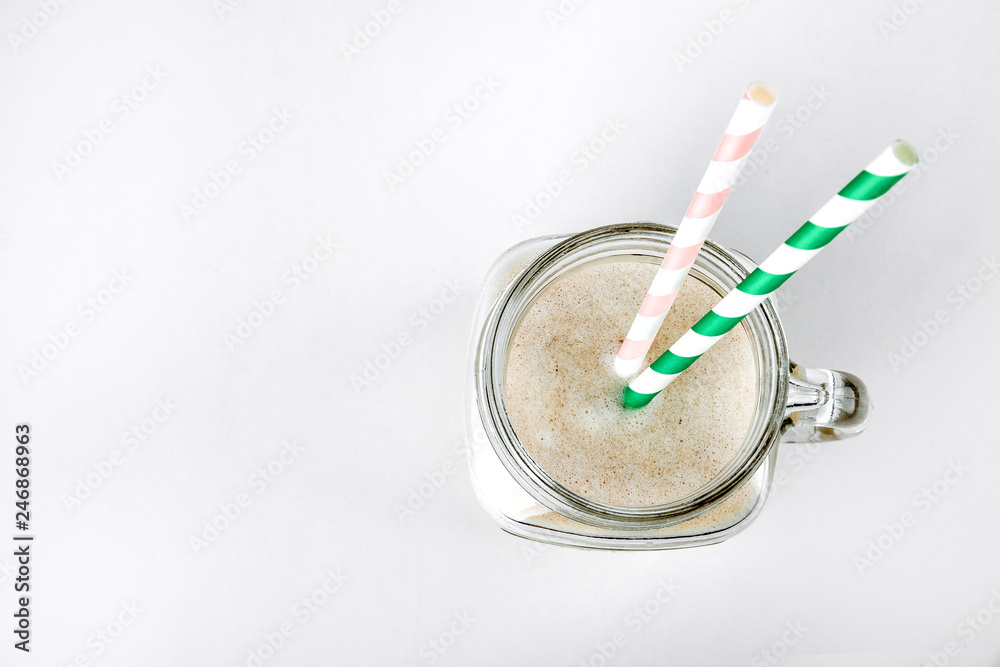 Protein cocktail with milk, vanilla in a glass jar with straws. Sports nutrition Protein cocktail with milk, vanilla in a glass jar with straws. Sports nutrition