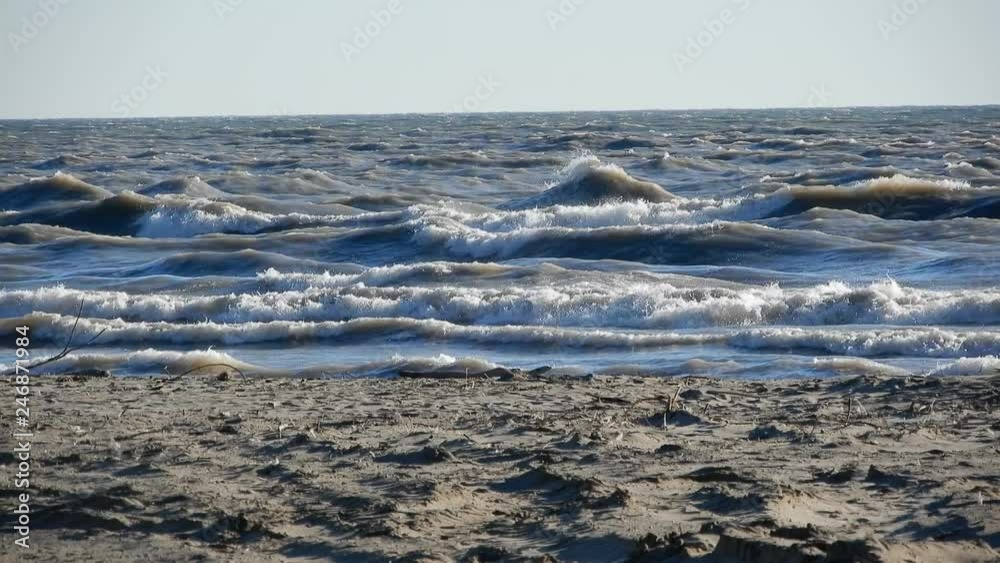 4K Waves Crashing Against Sandy Beach On Bright Sunny Day 4K Waves Crashing Against Sandy Beach On Bright Sunny Day