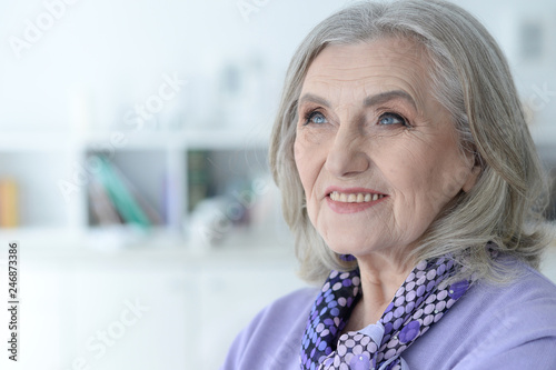 Portrait of happy senior woman posing at home