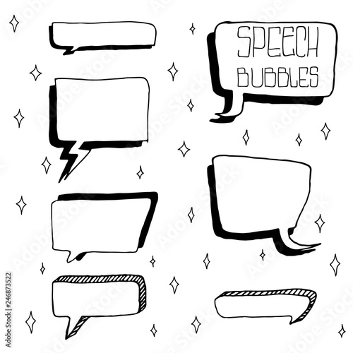 Set of Cute Hand Drawn Speech Bubbles in Doodle Style. Isolated on white sparks background.