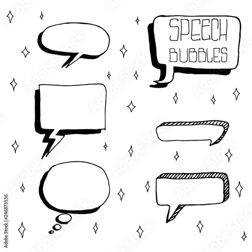 Set of Cute Hand Drawn Speech Bubbles in Doodle Style. Isolated on white sparks background.