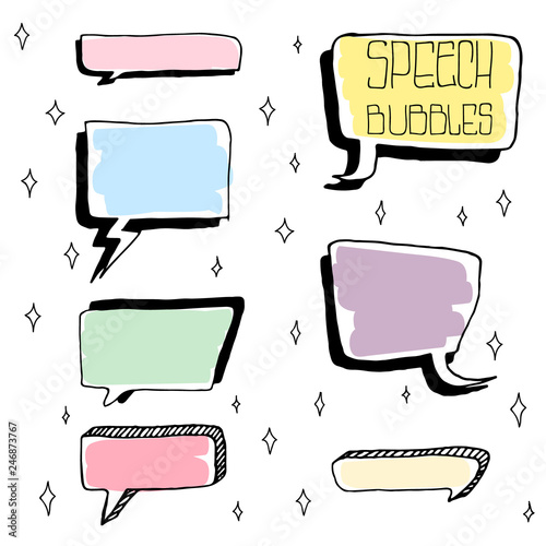 Set of Cute Hand Drawn Speech Bubbles in Doodle Style. Colorful on white sparks background.
