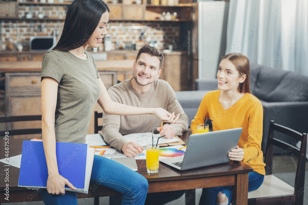 Charming three students joining efforts Charming three students joining efforts